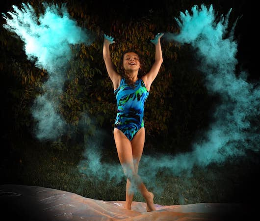 Picture of Emma throwing powder in the air